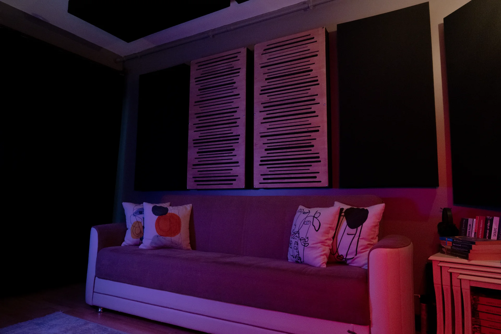 Cadence Track studio lounge under blue and magenta lighting